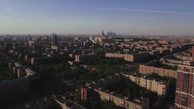 Flying over the Russian capital. Typical apartment blocks, streets and Lomonosov Moscow State University in the distance
