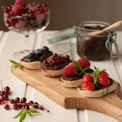 Toasts with chocolate and beries