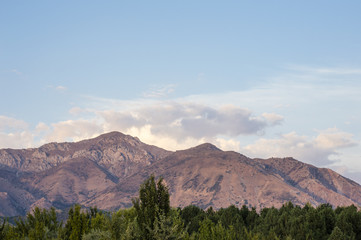 Fototapeta premium Western Tian Shan mountains in Ugam-Chatkal National Park view from Charvak Reservoir, Uzbekistan