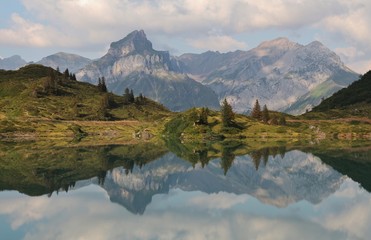 Mount Engelberger Rothorn mirroring in lake Trubsee