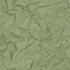 abstract background of crumpled green paper with blotches