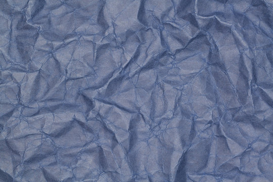 abstract background of crumpled blue paper
