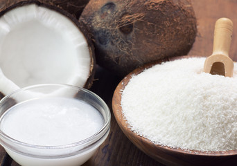 Coconuts and organic coconut oil in a glass jar