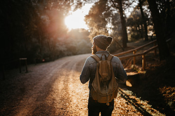 Man with backpack walking in the countryside