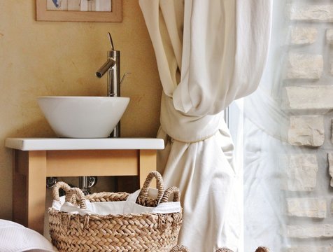 Interior detail of sink near a curtain