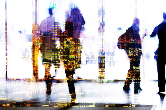 Silhouettes of business people walking in entrance hall. Multiple exposure blurred image. Business concept illustration.