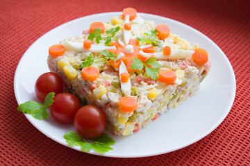 Salad of boiled chicken with boiled carrots, potatoes, egg and cucumber 