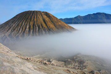 Turists climbing Mount Bromo -  an active volcano and part of the Tengger massif, in East Java, Indonesia. © robnaw