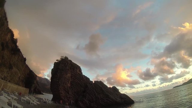 The coast of Montenegro in September. Beautiful panorama of the sunset over the Adriatic sea.