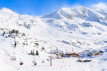 View of chairlifts and beautiful winter scenery in Obertauern ski resort, Austria