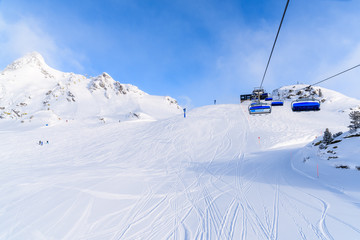 Fototapeta na wymiar View of chairlift and ski slope in Obertauern ski area, Austria