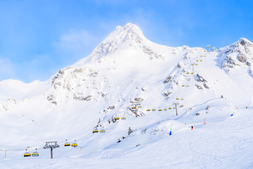 View of chairlift and mountain covered with fresh snow in Obertauern ski area, Austria