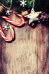 Christmas Card with  fir tree and  decoration on dark wooden boa