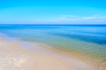 Fototapeta na wymiar Clear azure sea water of Leba beach, Baltic Sea, Poland