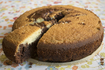  chocolate sponge cake with a cut slice
