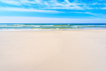 Fototapeta na wymiar White sand and beautiful sea on Debki beach, Baltic Sea, Poland