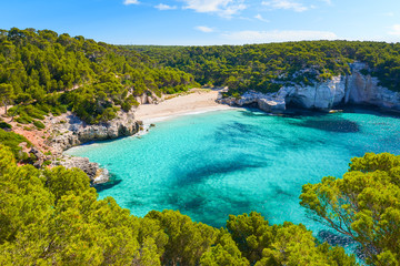 View of Mitjaneta beach with beautiful turquoise sea water, Menorca island, Spain - 135835069