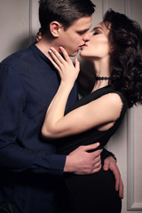 fashion studio photo of lovely impassioned couple in elegant out