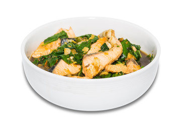 Spicy fried salmon with basil leaves