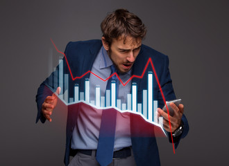 Businessman with chart in the fall, economy going down.