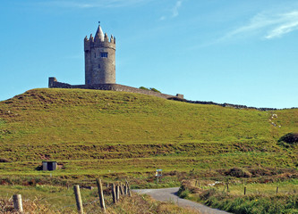 View of Doonagore Castle on the hill above the village of Doolin in County Clare, Ireland