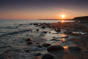 Sunset on the rocky beach