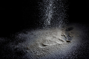 White flour on black backgorund texture photo