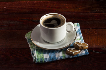  heart shaped cookies and white coffee cup