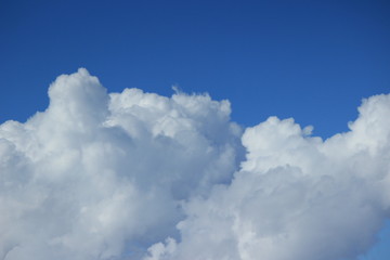 Naklejka na ściany i meble Clouds with blue sky in background