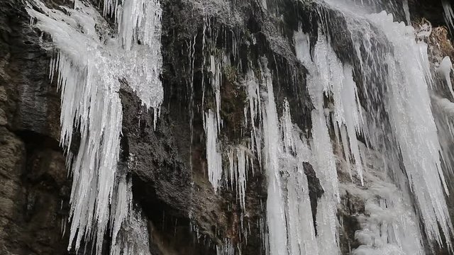 Beautiful frozen waterfall in Kamianets-Podilskyi city in western Ukraine