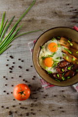 Ukrainian light breakfast. Breakfast in the pan on a wooden background