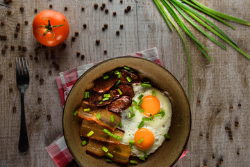 Ukrainian light breakfast. Breakfast in the pan on a wooden background