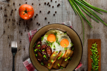 Ukrainian light breakfast. Breakfast in the pan on a wooden background