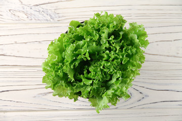 fresh green lettuce leaves in a bowl