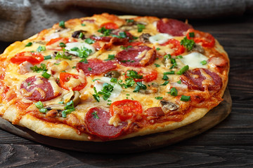 Homemade pizza on a rustic table