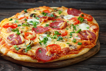 Homemade pizza on a rustic table