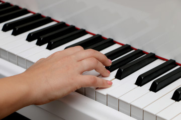 Close up piano, white and black keyboard