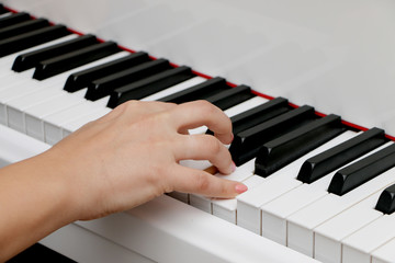 Close up piano, white and black keyboard