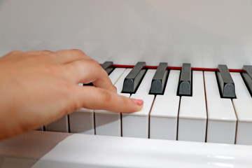 Close up piano, white and black keyboard