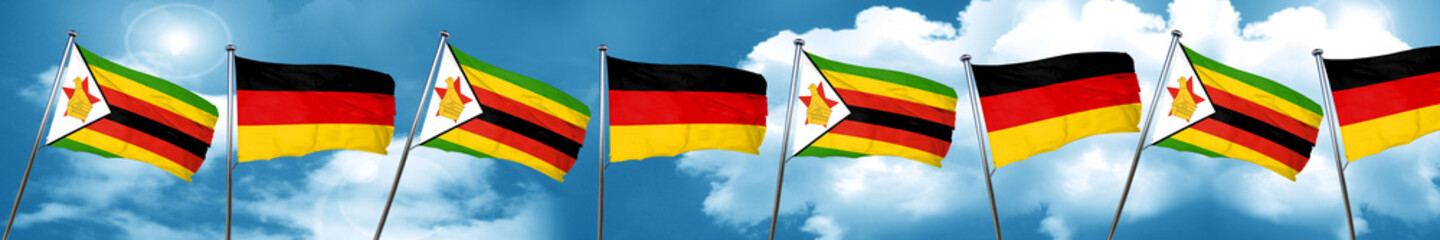 Zimbabwe flag with Germany flag, 3D rendering
