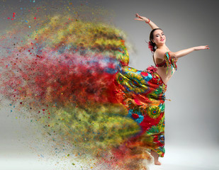 Dancer with disintegrating dress. Abstract vision.Photo manipula - 135851472