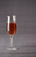Wineglass of Wine on Grey Background