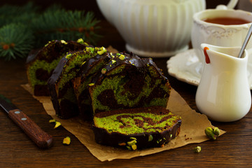 Chocolate pistachio cake with frosting.