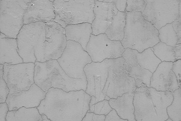 Wall fragment with scratches and cracks