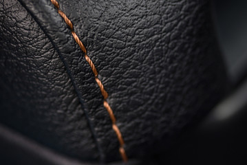 Car leather texture with stitch. Interior detail. Macro photo. - obrazy, fototapety, plakaty