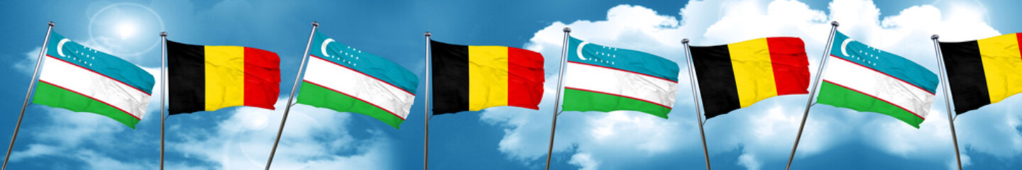 Uzbekistan flag with Belgium flag, 3D rendering