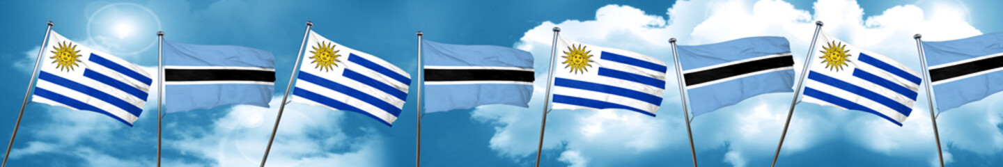 Uruguay flag with Botswana flag, 3D rendering
