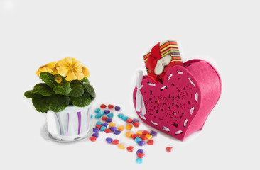 Hearts made of candy on Valentine's day with red basket