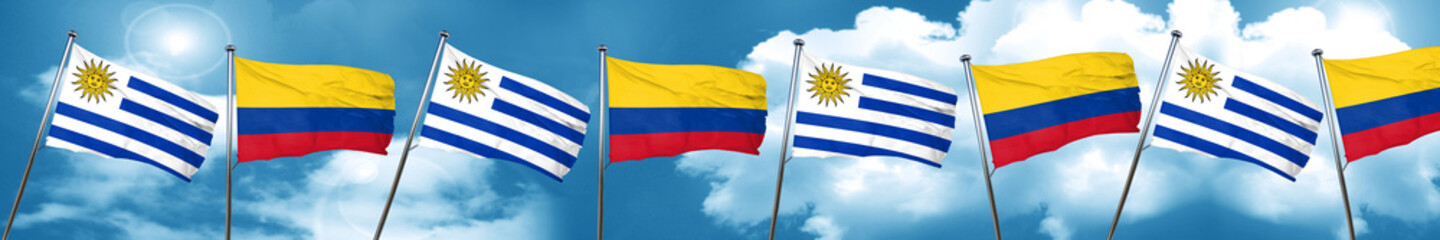 Uruguay flag with Colombia flag, 3D rendering