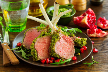 Rack of lamb in herb cheese and breadcrumbs. A festive meal. Selective focus.